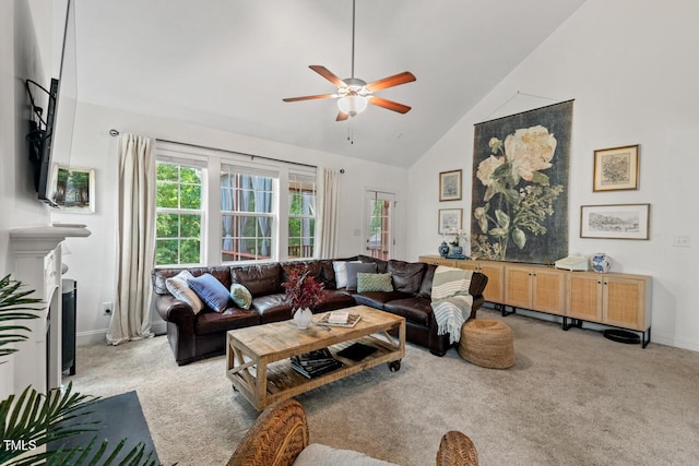 1612 Old Bramble Ln, Fuquay Varina, NC 27526 - living room with light carpet, ceiling fan, high vaulted ceiling, baseboards, and a fireplace with flush hearth