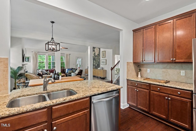 1612 Old Bramble Ln, Fuquay Varina, NC 27526 - kitchen with dishwasher, a sink, dark wood finished floors, decorative backsplash, and light stone counters