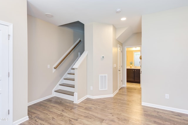 5908 Giddings St, Raleigh, NC 27616 - stairway featuring wood finished floors, baseboards, and recessed lighting