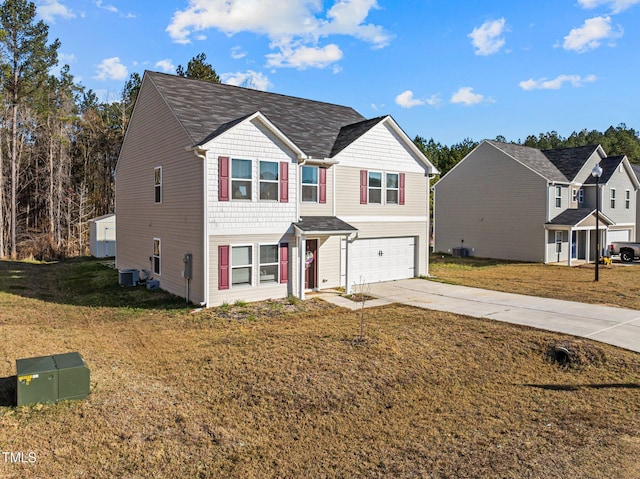 274 E Boulder Rd, Henderson, NC 27537 - view of front of home with an attached garage, concrete driveway, central air condition unit, and a front yard