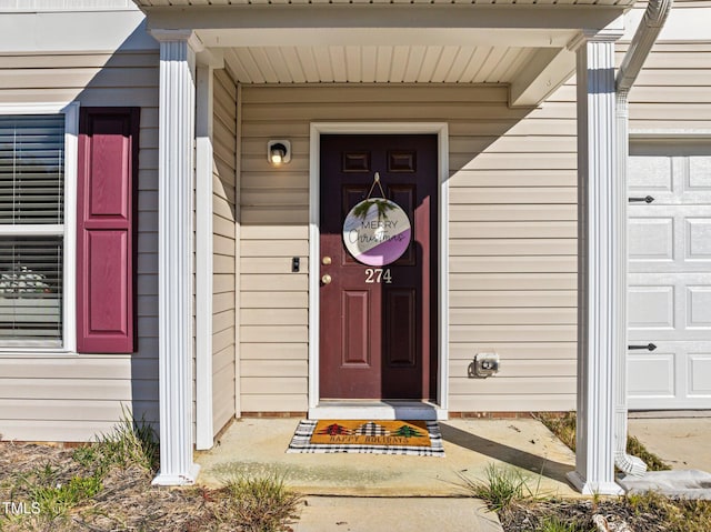 274 E Boulder Rd, Henderson, NC 27537 - doorway to property featuring an attached garage