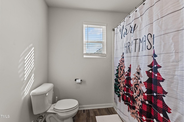 274 E Boulder Rd, Henderson, NC 27537 - full bath with wood finished floors, toilet, baseboards, and a shower with curtain
