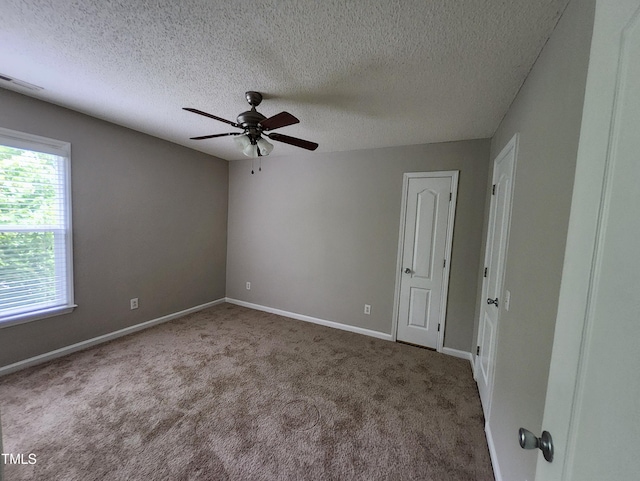 4903 Bridgewood Dr, Durham, NC 27713 - carpeted spare room with a ceiling fan, a textured ceiling, and baseboards