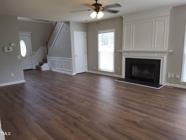 4903 Bridgewood Dr, Durham, NC 27713 - unfurnished living room featuring stairs, ceiling fan, dark wood-type flooring, and a fireplace