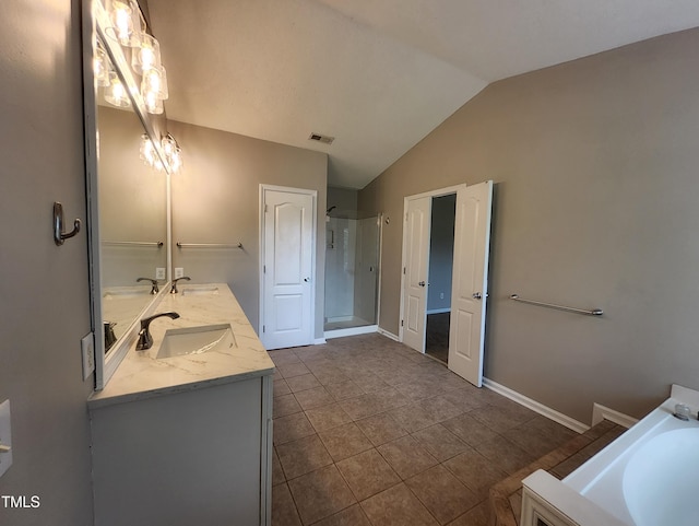 4903 Bridgewood Dr, Durham, NC 27713 - bathroom featuring double vanity, vaulted ceiling, a shower stall, tile patterned flooring, and a bathtub