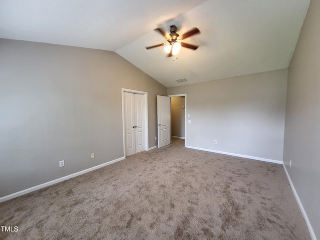 4903 Bridgewood Dr, Durham, NC 27713 - unfurnished bedroom with lofted ceiling, baseboards, carpet floors, and a closet