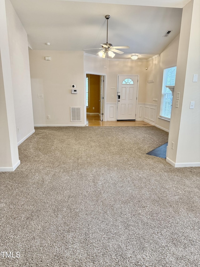 1017 Red Hat Ln, Durham, NC 27713 - unfurnished living room featuring carpet flooring, ceiling fan, and baseboards