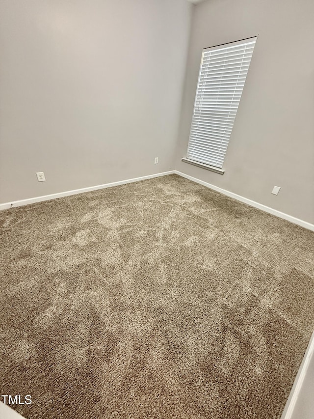 1017 Red Hat Ln, Durham, NC 27713 - carpeted empty room featuring baseboards