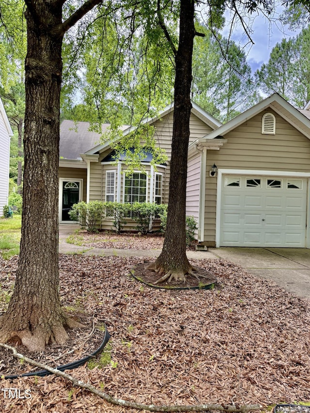 1017 Red Hat Ln, Durham, NC 27713 - view of front of home with driveway and an attached garage