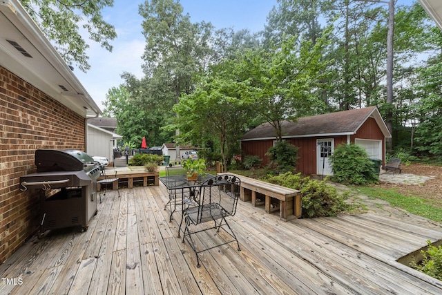 1040 Ivy Ln, Cary, NC 27511 - wooden terrace featuring outdoor dining space, grilling area, and an outdoor structure