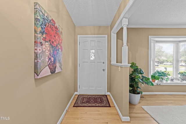 1040 Ivy Ln, Cary, NC 27511 - entryway featuring wood finished floors and a textured ceiling