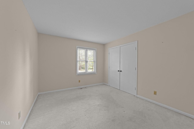 1040 Ivy Ln, Cary, NC 27511 - unfurnished bedroom featuring carpet flooring and a closet