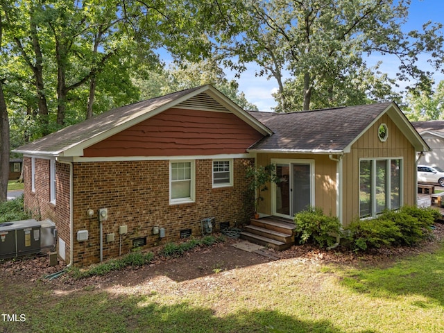 1040 Ivy Ln, Cary, NC 27511 - single story home with a shingled roof, a front lawn, and brick siding