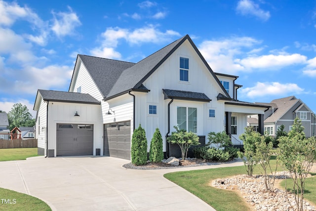 121 Nate Ct, Wake Forest, NC 27587 - modern farmhouse with board and batten siding, driveway, an attached garage, and a shingled roof