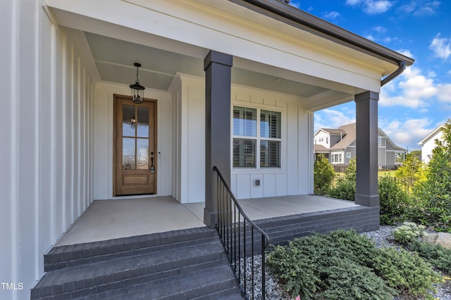 121 Nate Ct, Wake Forest, NC 27587 - doorway to property featuring board and batten siding and a porch