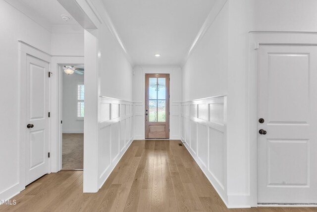 121 Nate Ct, Wake Forest, NC 27587 - foyer featuring a decorative wall, light wood-type flooring, plenty of natural light, wainscoting, and ornamental molding