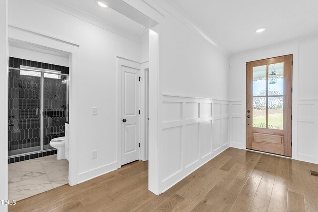 121 Nate Ct, Wake Forest, NC 27587 - entryway featuring a decorative wall, a wainscoted wall, wood finished floors, and recessed lighting