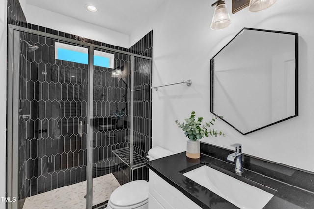 121 Nate Ct, Wake Forest, NC 27587 - bathroom with toilet, vanity, a shower stall, and recessed lighting