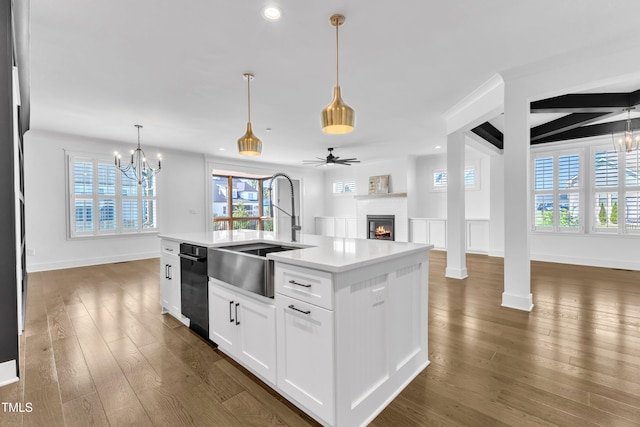 121 Nate Ct, Wake Forest, NC 27587 - kitchen with a sink, open floor plan, a warm lit fireplace, a chandelier, and recessed lighting