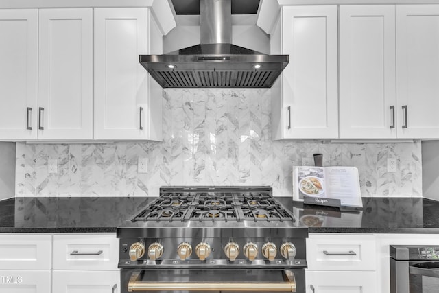 121 Nate Ct, Wake Forest, NC 27587 - kitchen with range with gas stovetop, wall chimney range hood, white cabinets, and tasteful backsplash