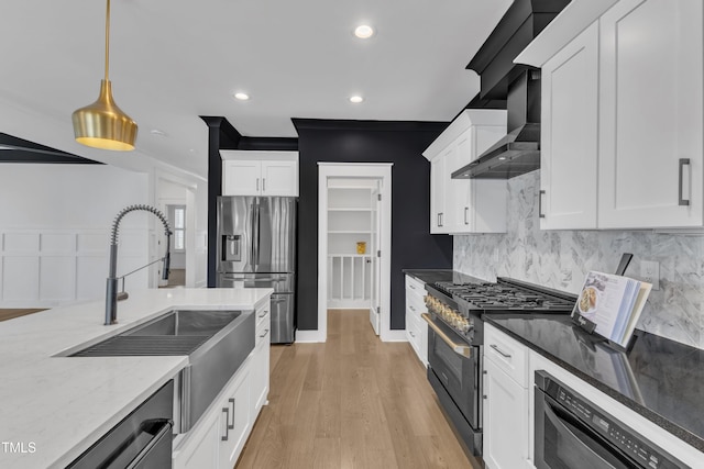 121 Nate Ct, Wake Forest, NC 27587 - kitchen with stainless steel appliances, tasteful backsplash, light stone countertops, white cabinets, and recessed lighting