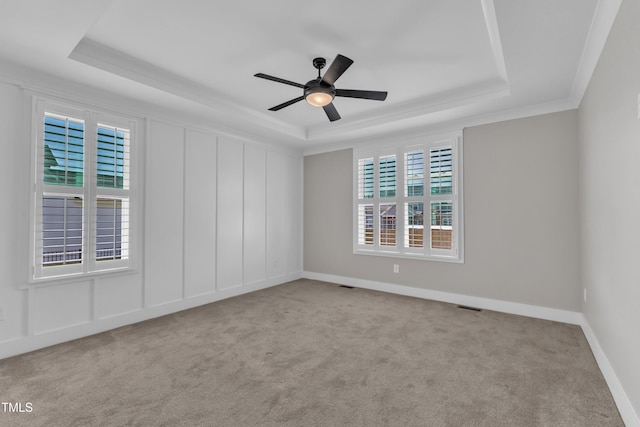 121 Nate Ct, Wake Forest, NC 27587 - unfurnished room featuring a tray ceiling, carpet flooring, a ceiling fan, ornamental molding, and baseboards