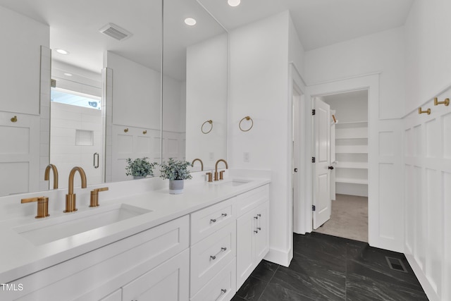 121 Nate Ct, Wake Forest, NC 27587 - bathroom with marble finish floors, double vanity, a stall shower, a spacious closet, and recessed lighting