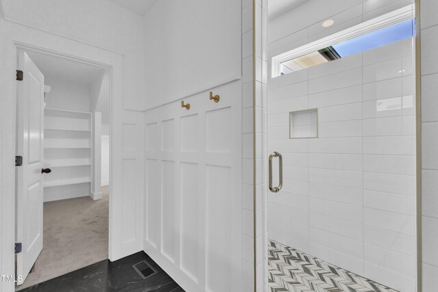 121 Nate Ct, Wake Forest, NC 27587 - bathroom with a stall shower and a walk in closet