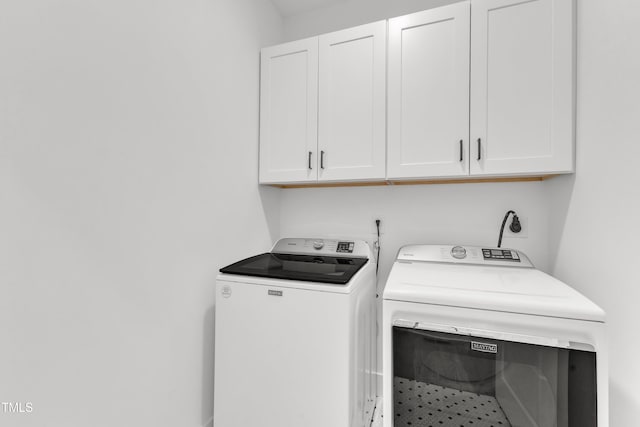 121 Nate Ct, Wake Forest, NC 27587 - laundry area featuring cabinet space and washing machine and clothes dryer