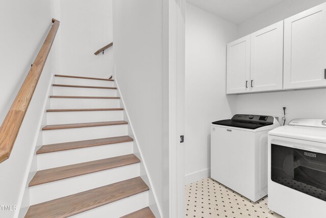 121 Nate Ct, Wake Forest, NC 27587 - laundry room featuring cabinet space, washer and clothes dryer, light flooring, and baseboards