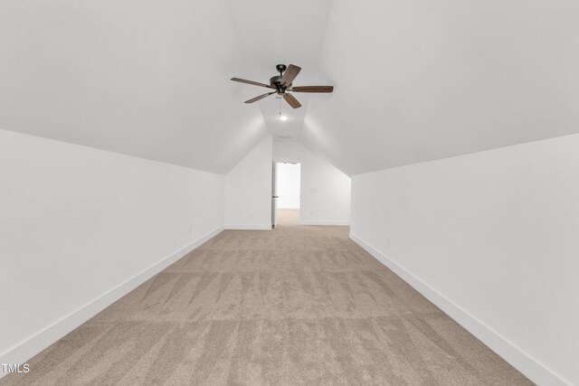 121 Nate Ct, Wake Forest, NC 27587 - bonus room with light carpet, ceiling fan, vaulted ceiling, and baseboards