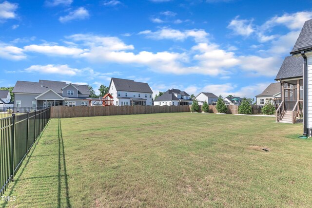 121 Nate Ct, Wake Forest, NC 27587 - view of yard featuring a residential view and a sunroom
