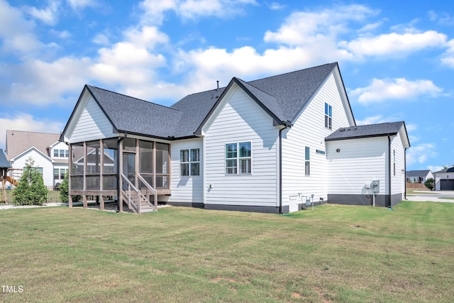 121 Nate Ct, Wake Forest, NC 27587 - back of property with a sunroom, a yard, and roof with shingles