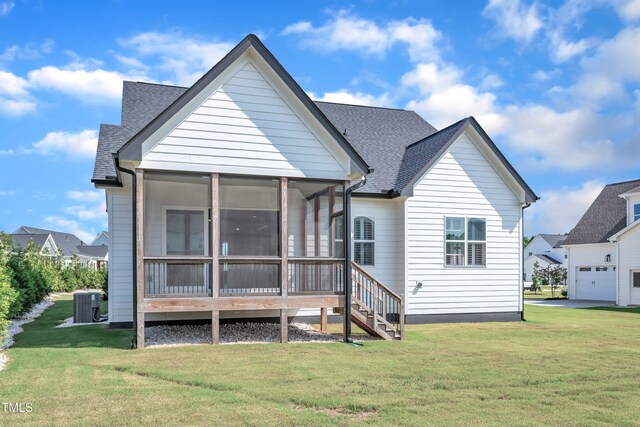 121 Nate Ct, Wake Forest, NC 27587 - rear view of house featuring a sunroom, a yard, central air condition unit, and a shingled roof