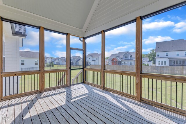 121 Nate Ct, Wake Forest, NC 27587 - unfurnished sunroom with lofted ceiling, a residential view, a deck, and wood finished floors