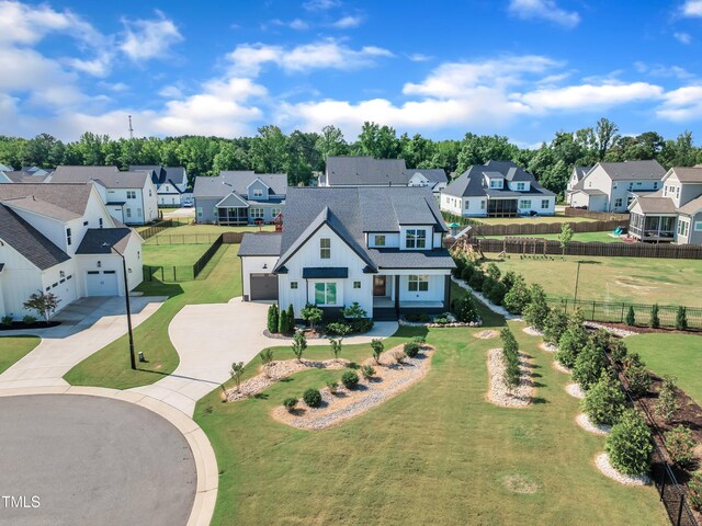121 Nate Ct, Wake Forest, NC 27587 - view of front facade with a residential view, driveway, a shingled roof, and an attached garage