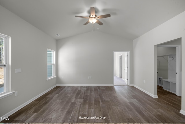 455 Beacon Hill Rd # 28, Lillington, NC 27546 - unfurnished bedroom with multiple windows, dark wood-style flooring, lofted ceiling, a spacious closet, and baseboards