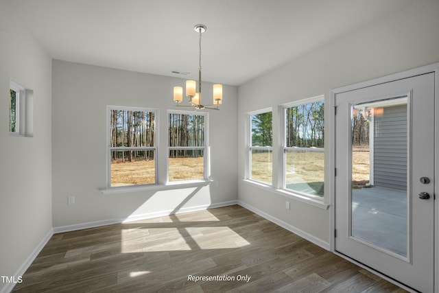 455 Beacon Hill Rd # 28, Lillington, NC 27546 - unfurnished dining area featuring a chandelier, wood finished floors, and baseboards