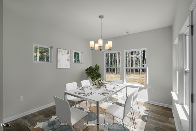 455 Beacon Hill Rd # 28, Lillington, NC 27546 - dining space with a chandelier, wood finished floors, and baseboards