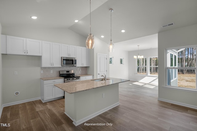 455 Beacon Hill Rd # 28, Lillington, NC 27546 - kitchen with appliances with stainless steel finishes, a sink, backsplash, white cabinets, and wood finished floors