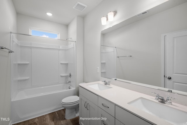 455 Beacon Hill Rd # 28, Lillington, NC 27546 - full bath featuring wood finished floors, double vanity, shower / bathtub combination, and toilet