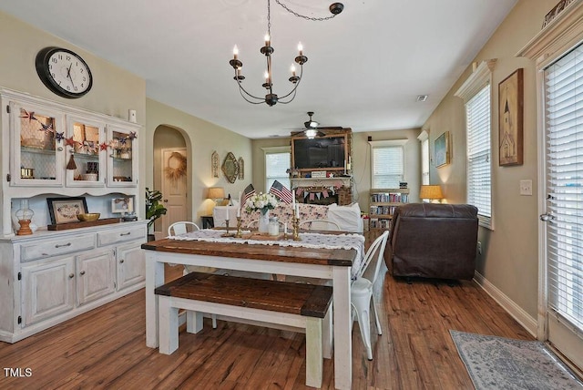 15 Scuppernong Ln, Lillington, NC 27546 - dining area with arched walkways, wood finished floors, a chandelier, and baseboards