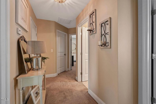 15 Scuppernong Ln, Lillington, NC 27546 - corridor with light colored carpet and baseboards