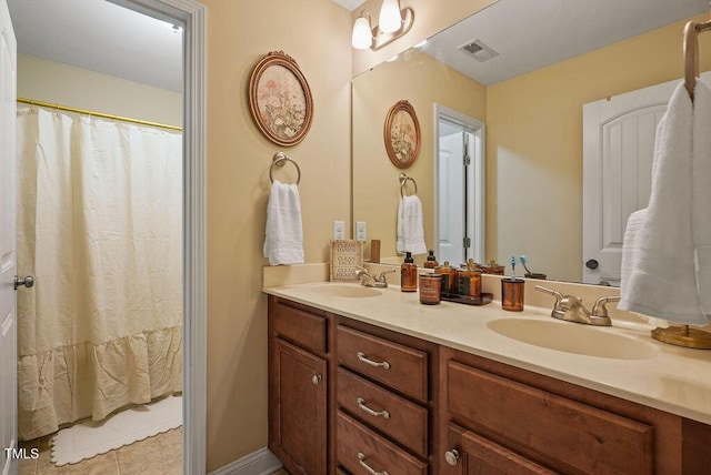 15 Scuppernong Ln, Lillington, NC 27546 - bathroom with double vanity and tile patterned flooring