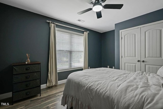 15 Scuppernong Ln, Lillington, NC 27546 - bedroom with wood finished floors, baseboards, a closet, and a ceiling fan