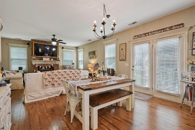 15 Scuppernong Ln, Lillington, NC 27546 - dining space featuring a ceiling fan, wood-type flooring, and a chandelier