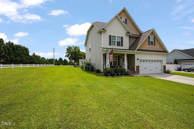 15 Scuppernong Ln, Lillington, NC 27546 - craftsman house featuring concrete driveway, a porch, board and batten siding, a garage, and central AC unit