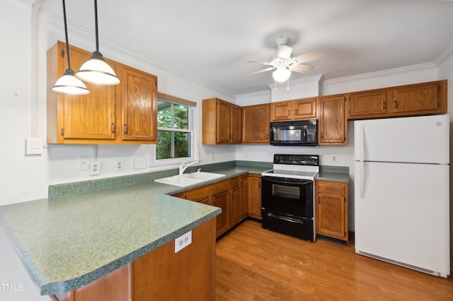 3405 E Jameson Rd, Raleigh, NC 27604 - kitchen featuring freestanding refrigerator, black microwave, electric range, a peninsula, and brown cabinetry