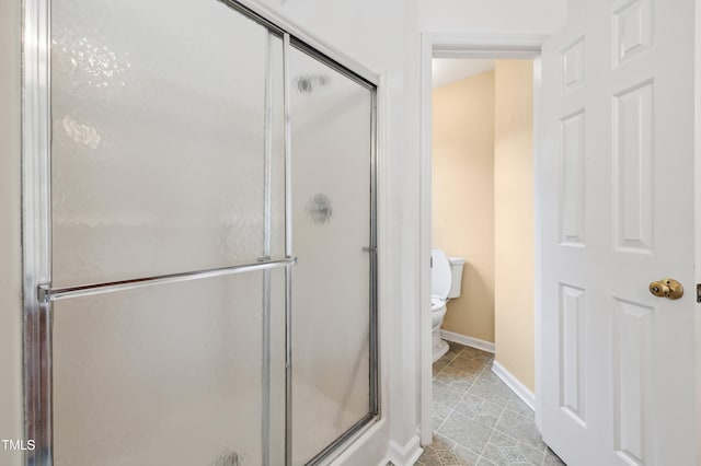 3405 E Jameson Rd, Raleigh, NC 27604 - bathroom featuring toilet, a stall shower, baseboards, and tile patterned flooring