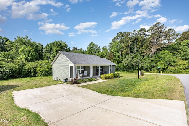 18 Hunter Fox Trl, Angier, NC 27501 - single story home with a porch, a front yard, and roof with shingles